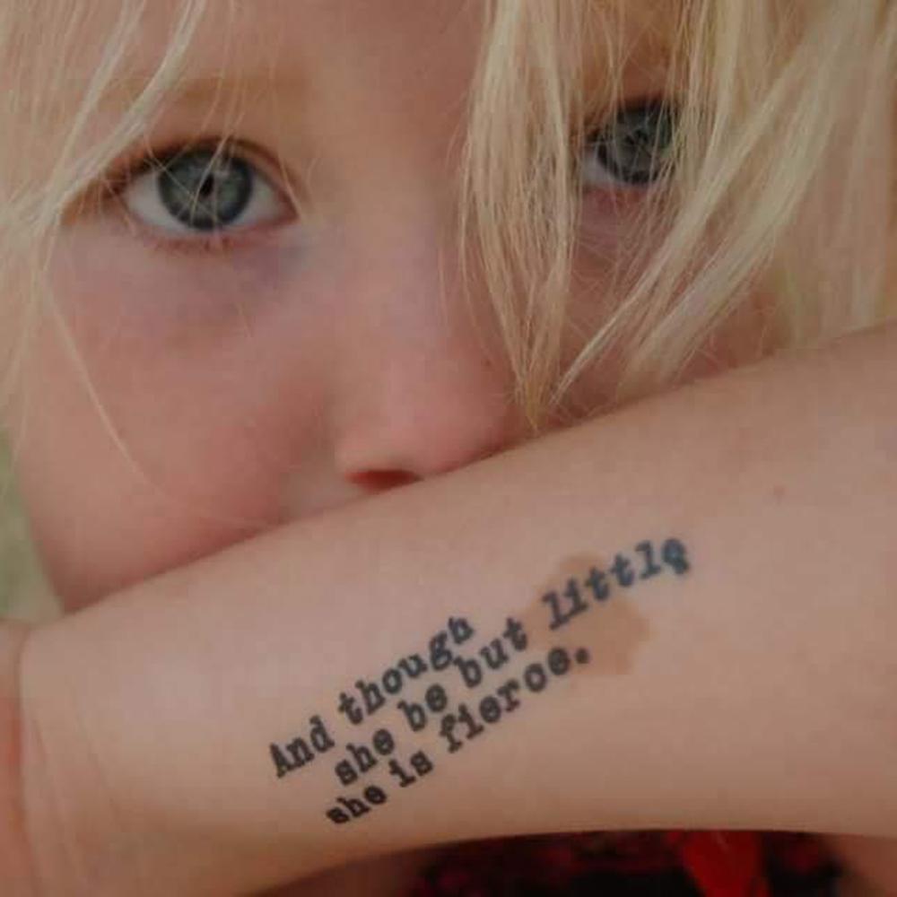 Little Tattoos — Side tattoo that says “Karma” on Julie.